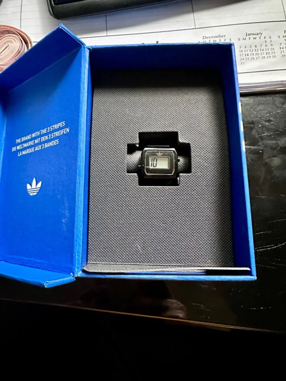 Black Adidas Originals digital two ring watch for finger